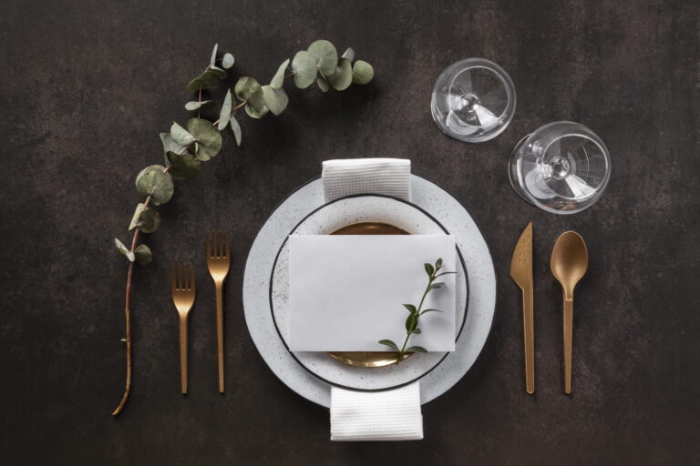 plates cutlery glasses flat lay scaled